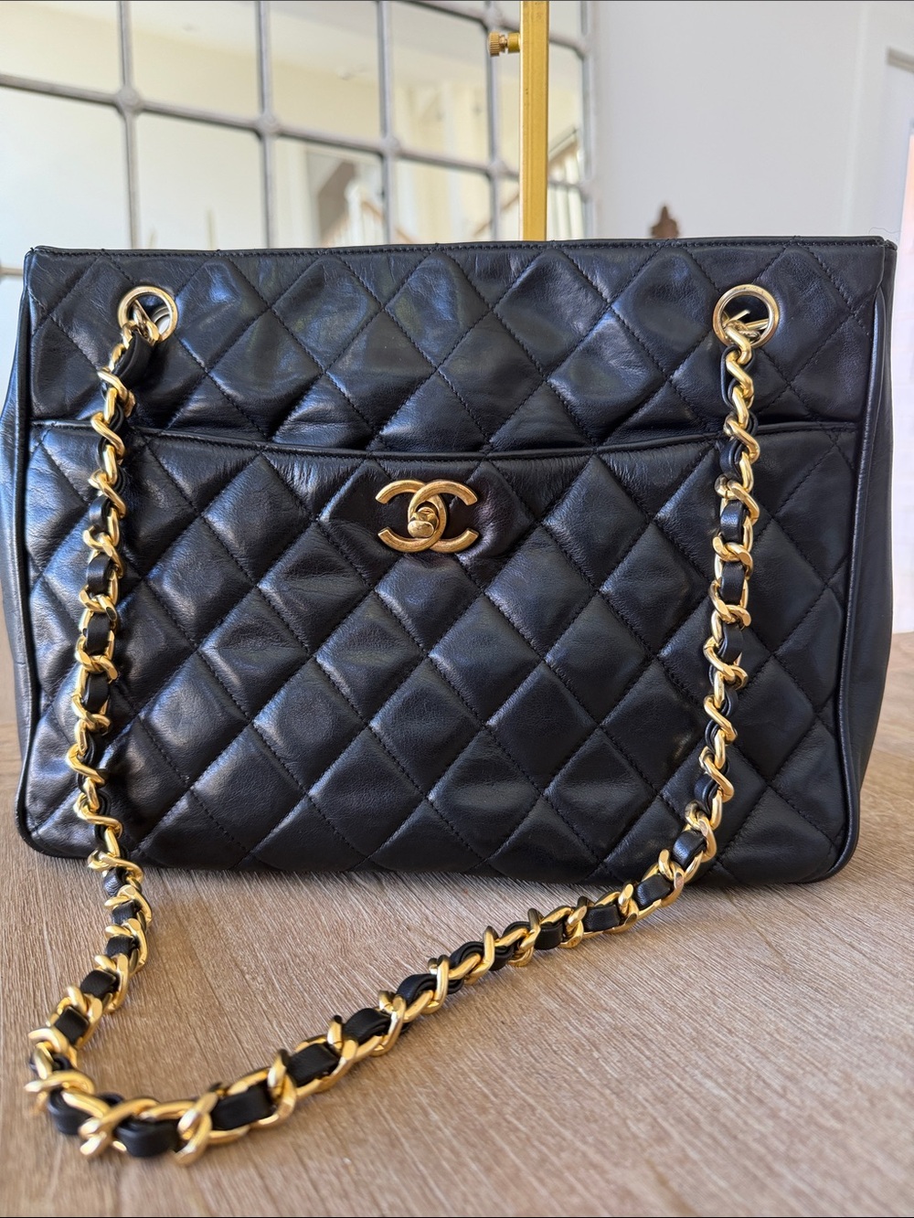 CHANEL Black Quilted Leather Shoulder Bag with Gold Chain Straps